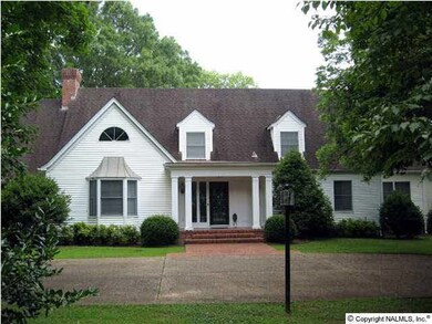 COVERED FRONT PORCH AND CIRCULAR DRIVE