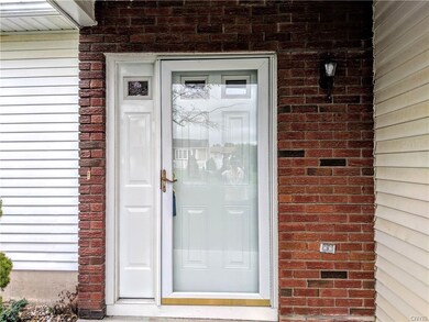 Nice covered entry with newer front door.