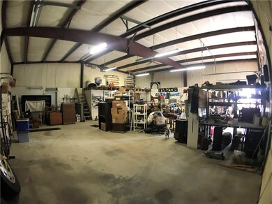 All metal shop fully insulated, and has plumbing and electric.