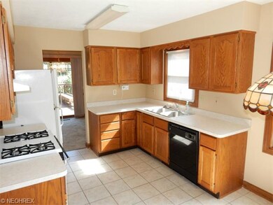 Kitchen with tile floors and all appliances stay!