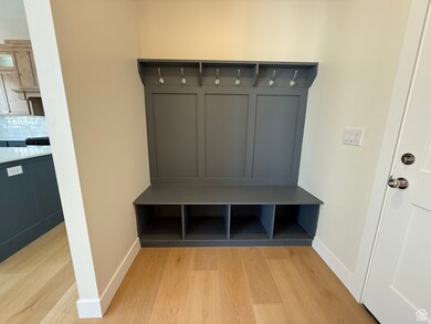 Mudroom with light wood-style flooring