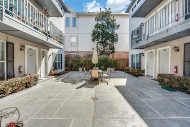 View of patio with outdoor dining space and fence