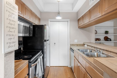 Kitchen featuring stainless steel appliances, a s