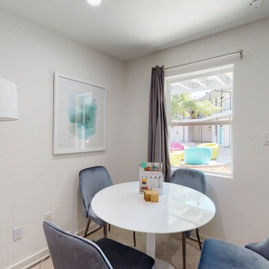 Dining room with baseboards and tile patterned floors