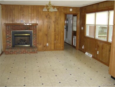 Family and or Dining Area Adjacent to Open Kitchen (view is into Utility Room)...Gas log fireplace