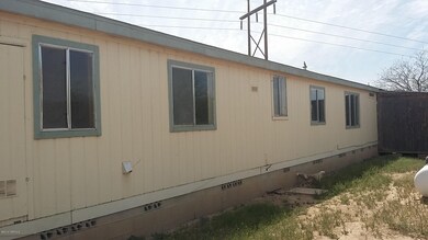 BACK OF HOME. NO A/C
