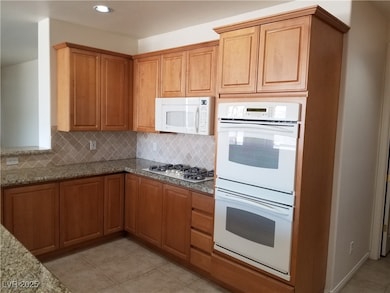 Kitchen featuring recessed lighting, decorative ba