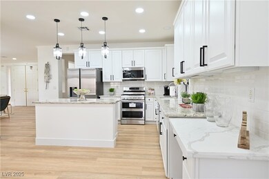 Kitchen featuring appliances with stainless steel