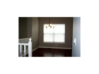DINING ROOM FEATURES NEW WOOD LAMINATE FLOORS AND 