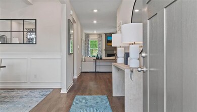 Entrance foyer featuring dark hardwood / wood-styl