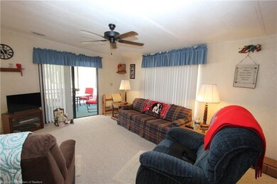 Living Room with sliders to screened porch.