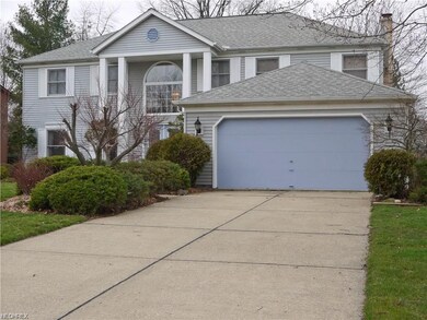 2 car attached garage with paved driveway.