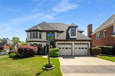 French country style house featuring a garage, stu