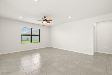 FAMILY ROOMfeaturing a ceiling fan, recessed lighting, and light tile patterned floors