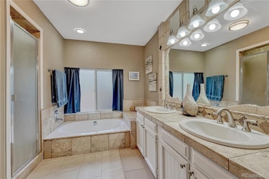 Primary bathroom with double sink, shower and tub.