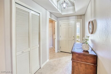 Entrance foyer featuring light tile patterned floo