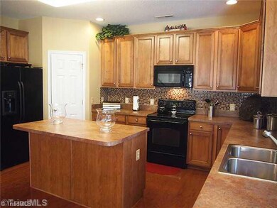 Kitchen. Another view of the beautiful kitchen and note wood floors.  Stainless double sink.