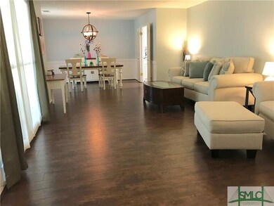 Family room flowing to the dining area.  Freshly p