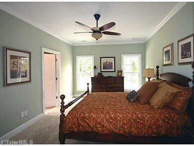 Master Bedroom. Large master bedroom with crown molding, walking closet, and view of back yard.