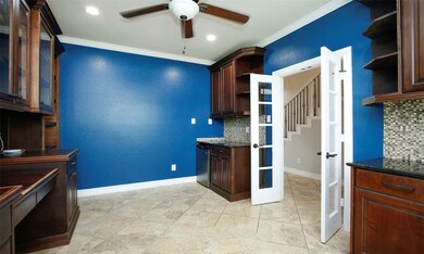 Another view of the study.  Notice the cam lighting and ceiling fan.