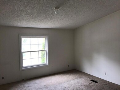 One of three large bedrooms