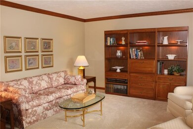 the living room can easily be converted to a den a