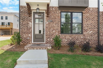 Property entrance featuring brick siding
