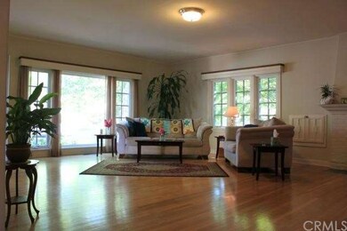 Living room view, polished hardwood floors and hig