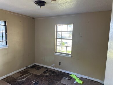 Spare room featuring a textured ceiling