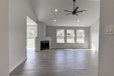 Unfurnished living room featuring lofted ceiling,