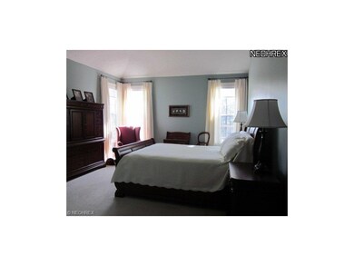 The master bedroom faces the rear of the home look