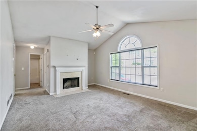 Unfurnished living room with carpet, a premium fir