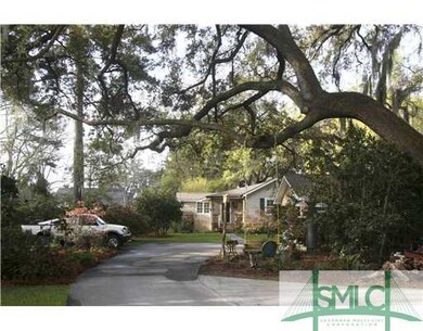 Exterior Front. gorgeous live oak with swing for c