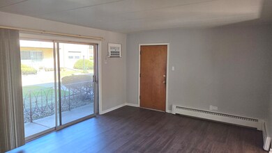 Big glass sliding doors lead to a private balcony.