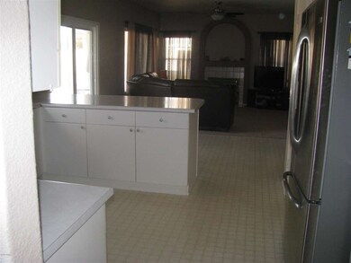 View from Kitchen to Living rm w/fplc