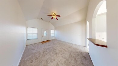 living room with vaulted ceiling, brand new carpet