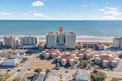Aerial view featuring a water view and a view of t