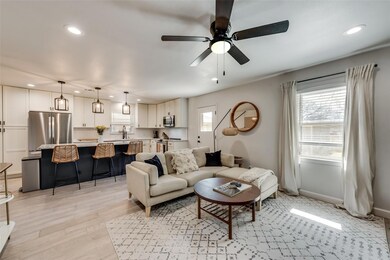 Living room featuring light wood-style floors, bas