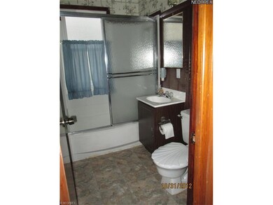 First floor bathroom with new vinyl flooring and a