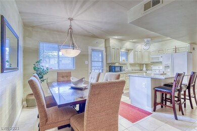 Separate dining room adjacent to island kitchen