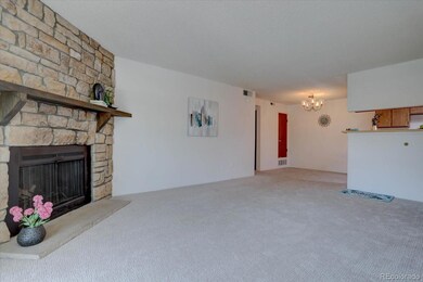 Spacious family room with fireplace & brand new carpeting!