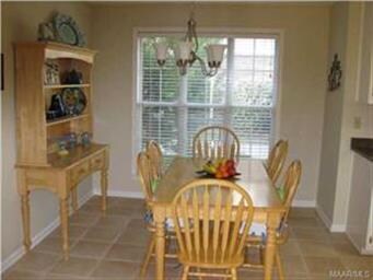 The breakfast area adjoining the kitchen is bright
