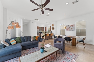 Bright and spacious living area with modern furnis