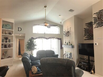 Living room has sliding glass doors that exit to t