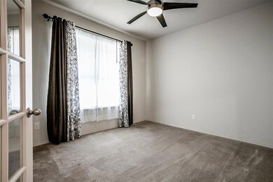 French doors immediately to the left of the entran
