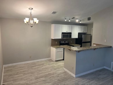 Kitchen featuring appliances with stainless steel