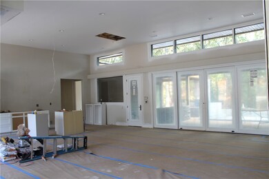 This photo partially shows the kitchen.  The slidi