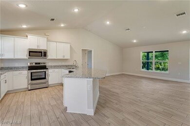 Kitchen featuring visible vents, appliances with s