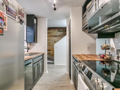 Kitchen with sink, decorative backsplash, light wo