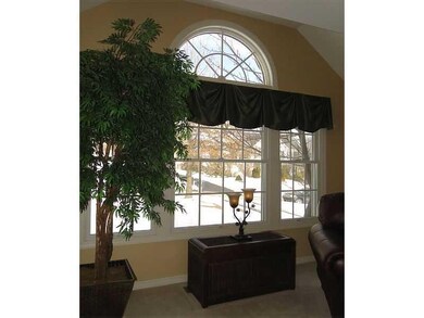 Living Room. Lovely architectural window and ceili